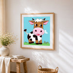 Funny cartoon cow cross stitch artwork displayed on wall as home decor