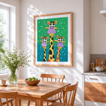 Funny cartoon giraffes in the snow cross stitch artwork displayed on wall as home decor