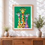 Finished funny cartoon giraffes with shocked faces cross stitch artwork displayed