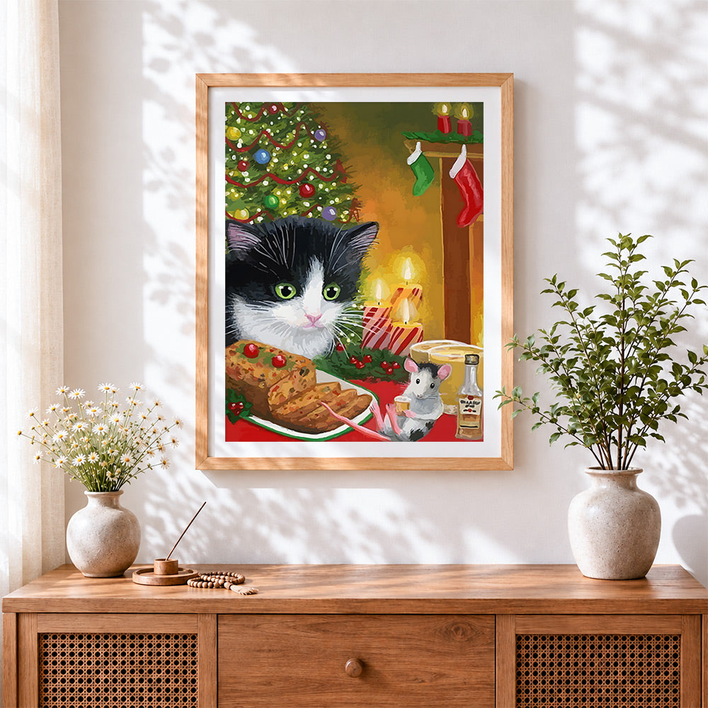 Finished funny cat, mouse and christmas pudding cross stitch artwork displayed