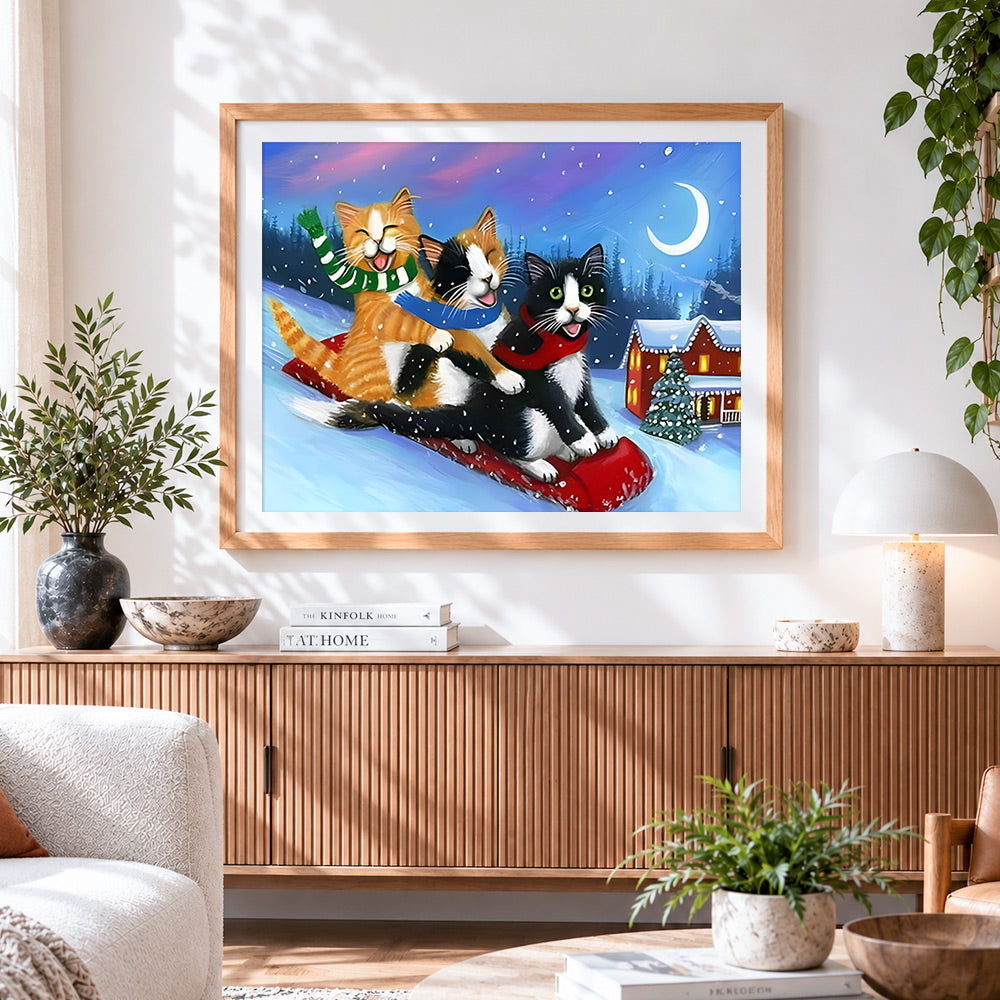 Finished funny cats sledging in the snow cross stitch artwork displayed
