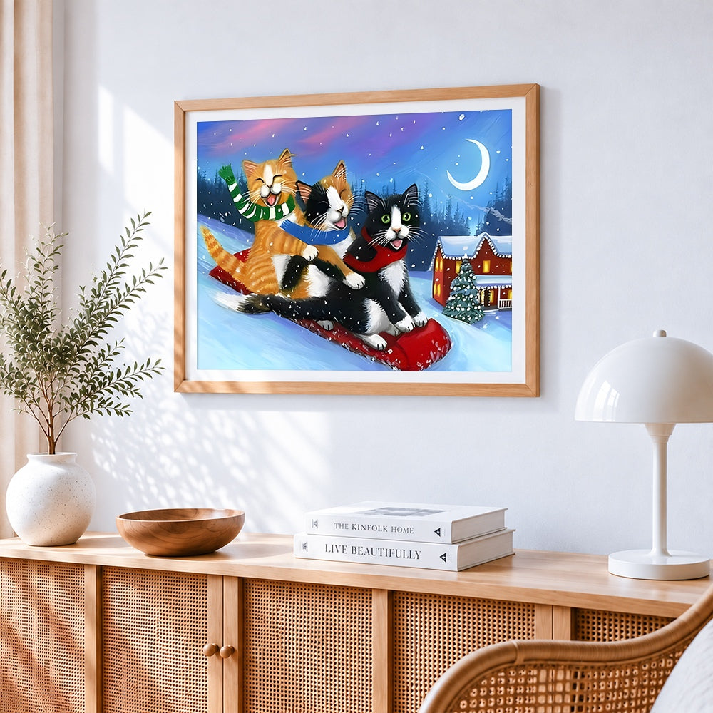 Funny cats sledging in the snow cross stitch artwork displayed on wall as home decor