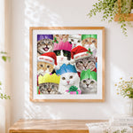 Finished funny christmas cats in santa hats cross stitch artwork displayed