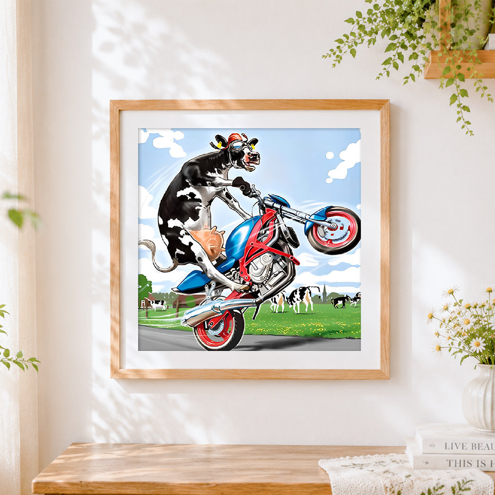Finished funny cow riding a motorbike cross stitch artwork displayed