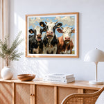Funny curious cows cross stitch artwork displayed on wall as home decor