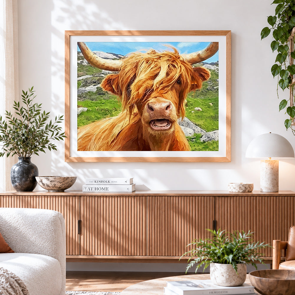 Finished funny highland cow portrait cross stitch artwork displayed