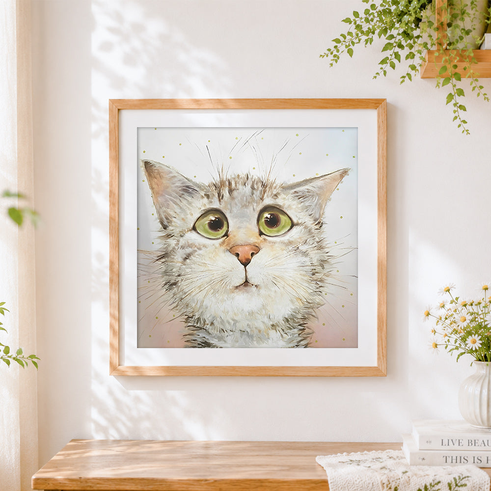 Finished funny surprised cat cross stitch artwork displayed