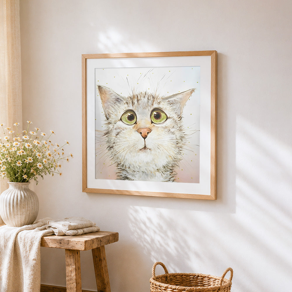 Funny surprised cat cross stitch artwork displayed on wall as home decor