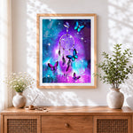Finished galaxy dreamcatcher with butterflies cross stitch artwork displayed