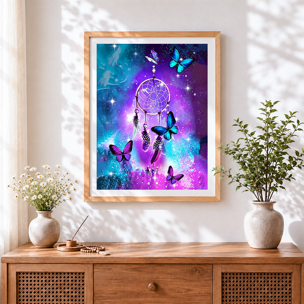 Finished galaxy dreamcatcher with butterflies cross stitch artwork displayed