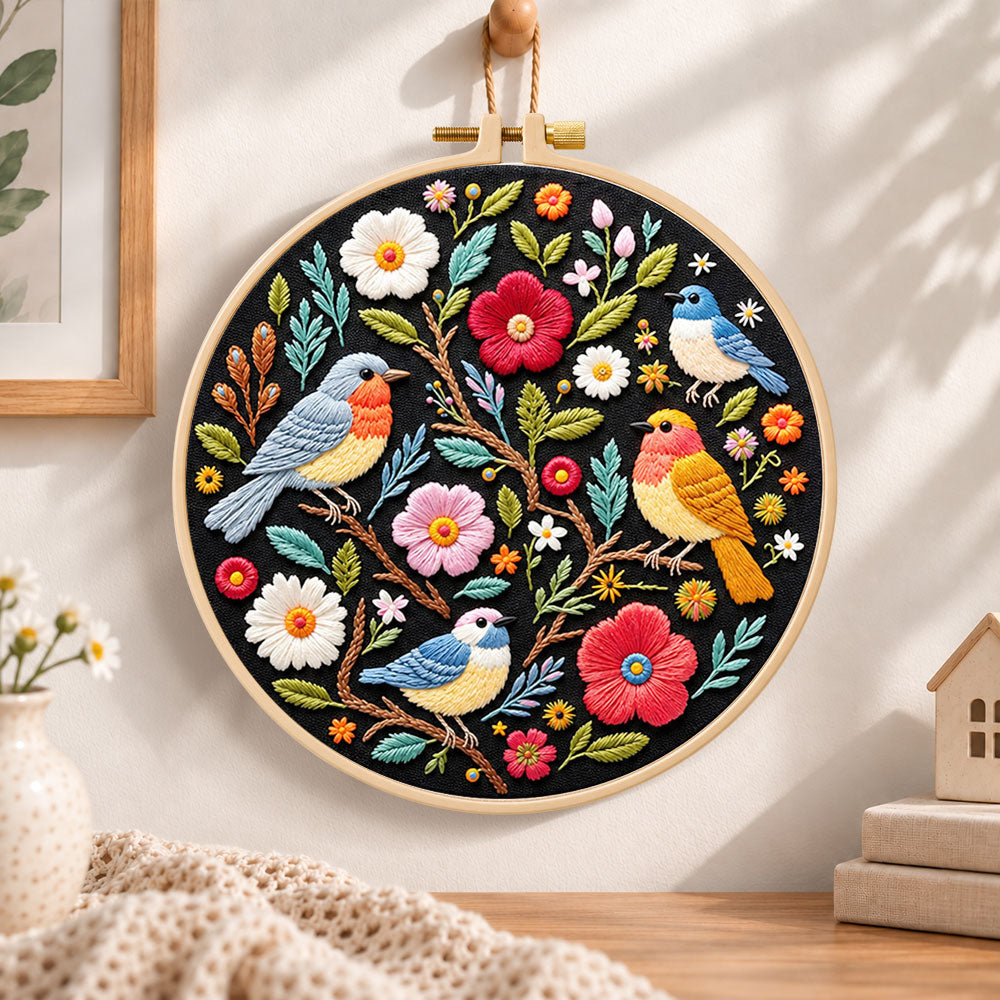 Garden birds and blossoms embroidery hoop wall art displayed as warm and cosy handmade home decor