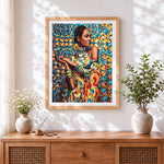 Finished geometric african woman with collar cross stitch artwork displayed