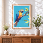 Finished geometric blue and yellow macaw cross stitch artwork displayed