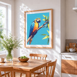 Geometric blue and yellow macaw cross stitch artwork displayed on wall as home decor