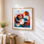 Geometric circles and colour blocks cross stitch artwork displayed on wall as home decor