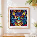 Finished geometric colourful cat portrait cross stitch artwork displayed