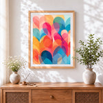 Finished geometric pastel hearts cross stitch artwork displayed