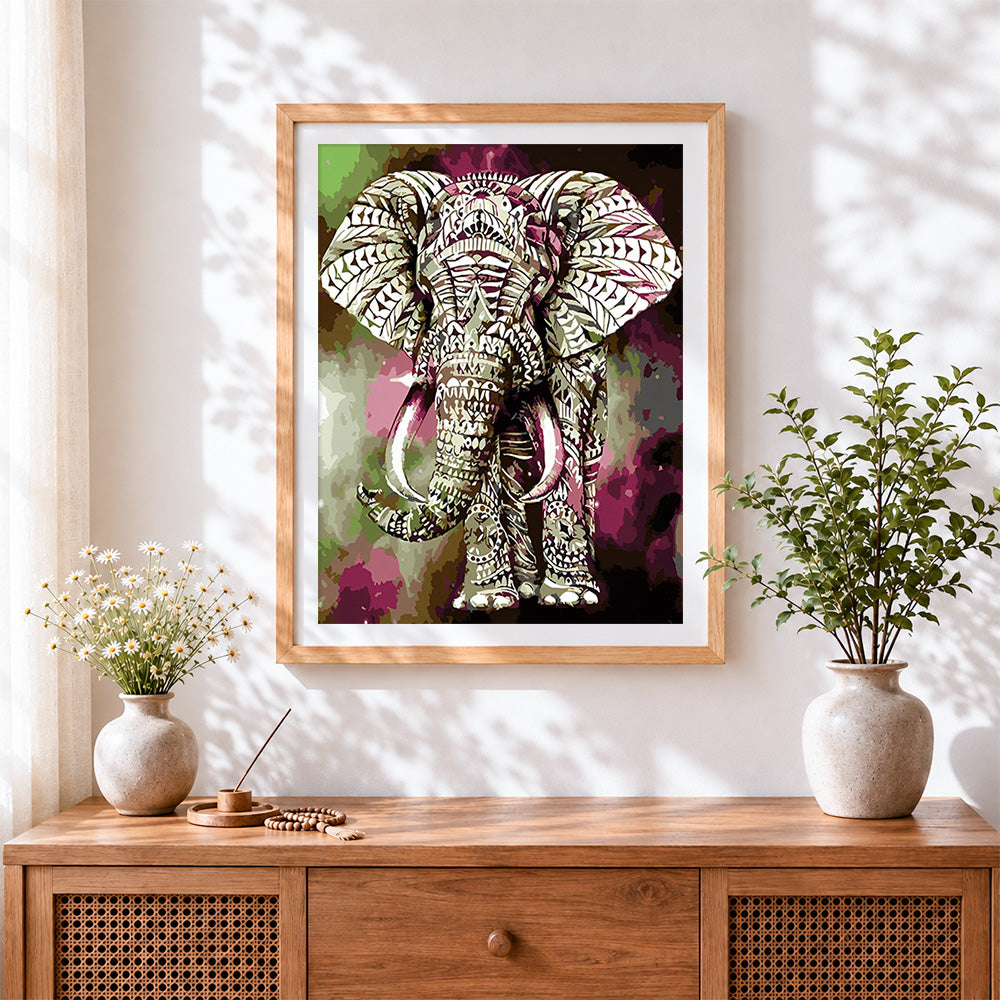 Finished geometric patterned elephant cross stitch artwork displayed