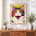 Finished geometric pop art cat face cross stitch artwork displayed