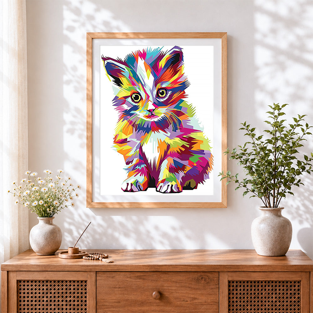 Finished geometric pop art kitten cross stitch artwork displayed