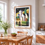 Geometric village with moon cross stitch artwork displayed on wall as home decor
