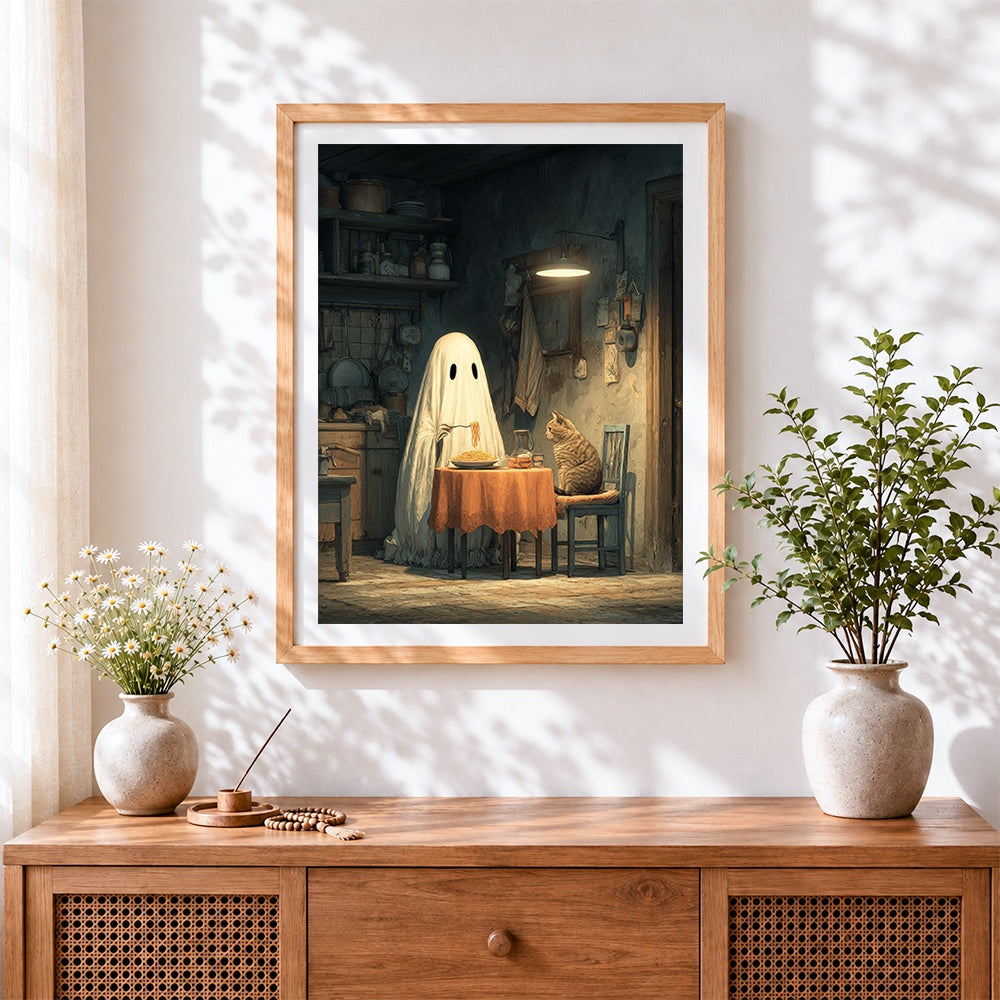Finished ghost and cat eating spaghetti cross stitch artwork displayed