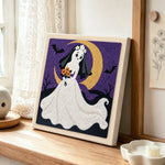 Ghost bride with moon punch needle artwork displayed on a table