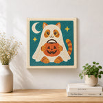 Finished ghost cat trick‑or‑treat artwork displayed on a wall