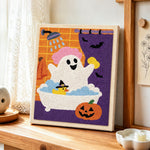 Ghost taking bubble bath punch needle artwork displayed on a table