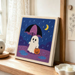 Ghost with rain umbrella punch needle artwork displayed on a table