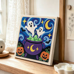 Ghosts in magic cauldron punch needle artwork displayed on a table