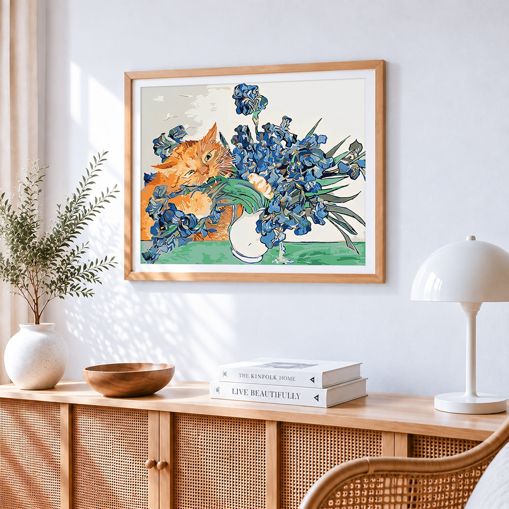 Ginger cat and blue irises cross stitch artwork displayed on wall as home decor