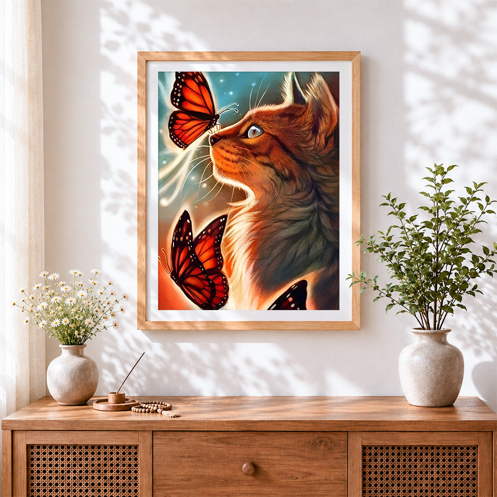 Finished ginger cat and orange butterflies cross stitch artwork displayed