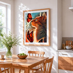 Ginger cat and orange butterflies cross stitch artwork displayed on wall as home decor