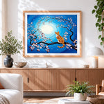 Finished ginger cat in a cherry blossom tree cross stitch artwork displayed