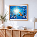 Ginger cat in a cherry blossom tree cross stitch artwork displayed on wall as home decor
