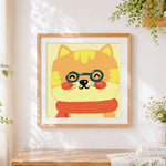 Finished ginger cat with glasses cross stitch artwork displayed