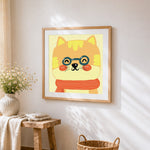 Ginger cat with glasses cross stitch artwork displayed on wall as home decor