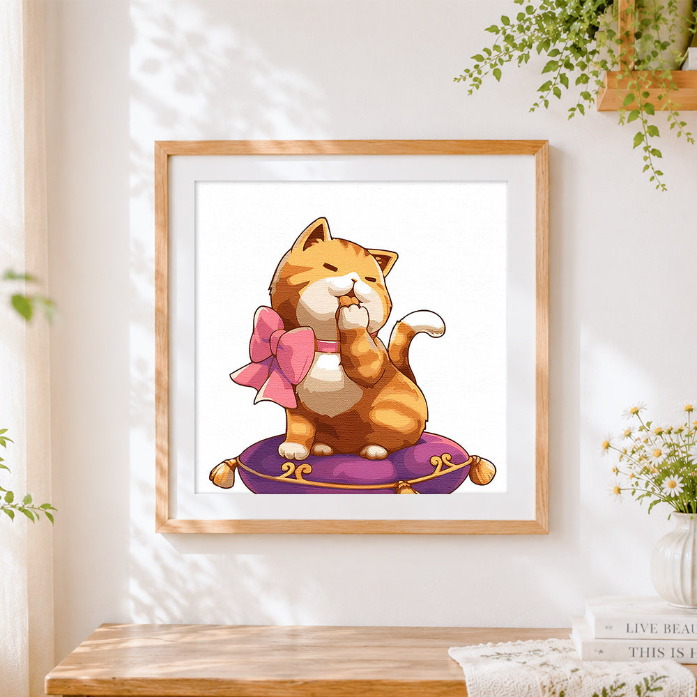 Finished ginger cat with pink bow cross stitch artwork displayed