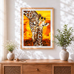 Finished giraffe and calf at sunset paint by numbers artwork displayed as home decor