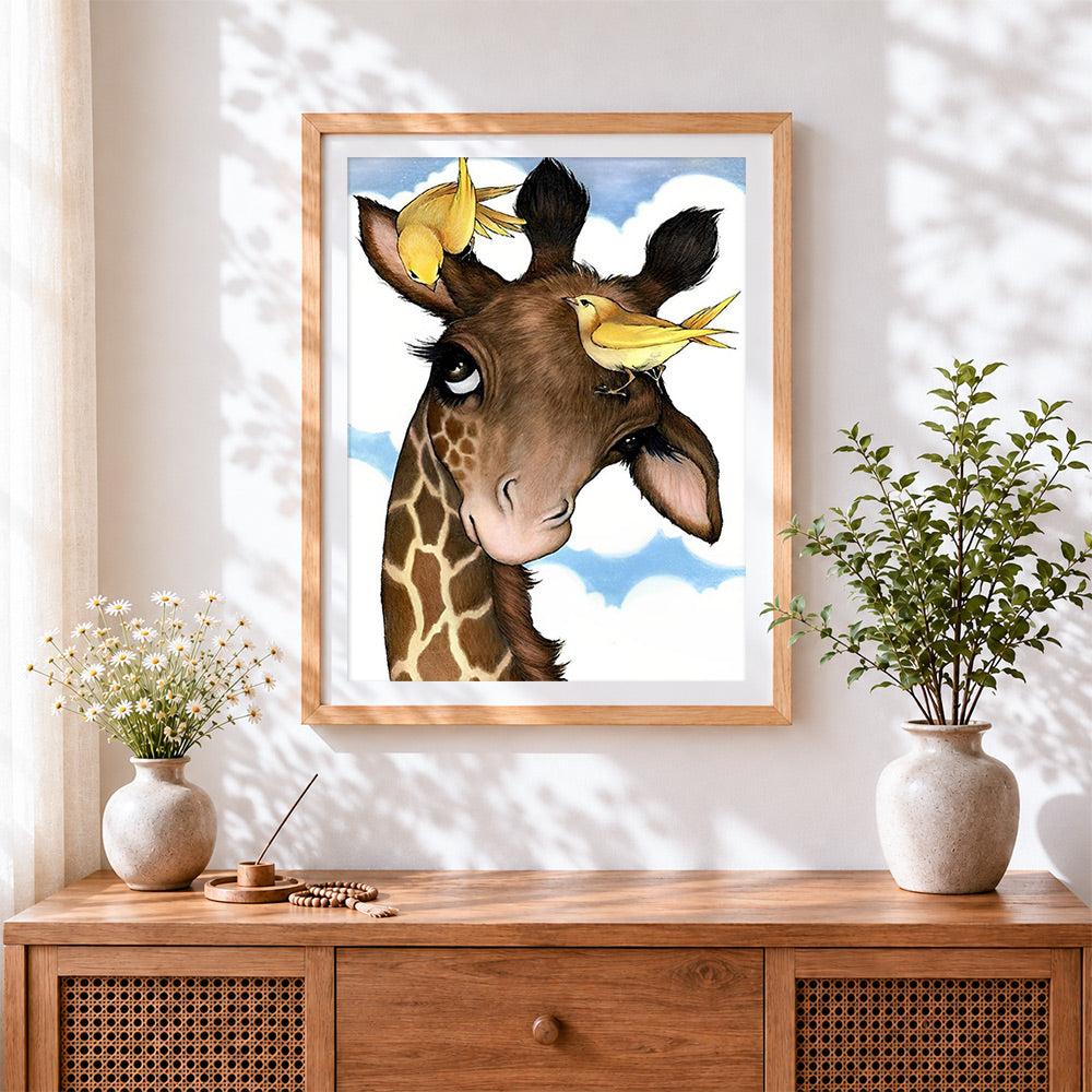 Finished giraffe and yellow birds cross stitch artwork displayed