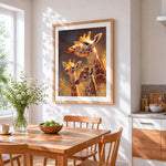 Giraffe family in the golden light cross stitch artwork displayed on wall as home decor