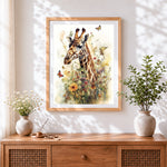 Finished giraffe surrounded by flowers and butterflies cross stitch artwork displayed