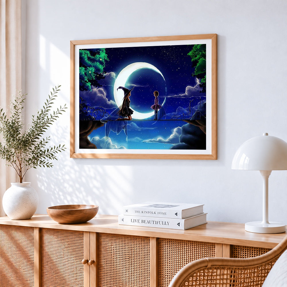 Girl and witch on a crescent moon cross stitch artwork displayed on wall as home decor