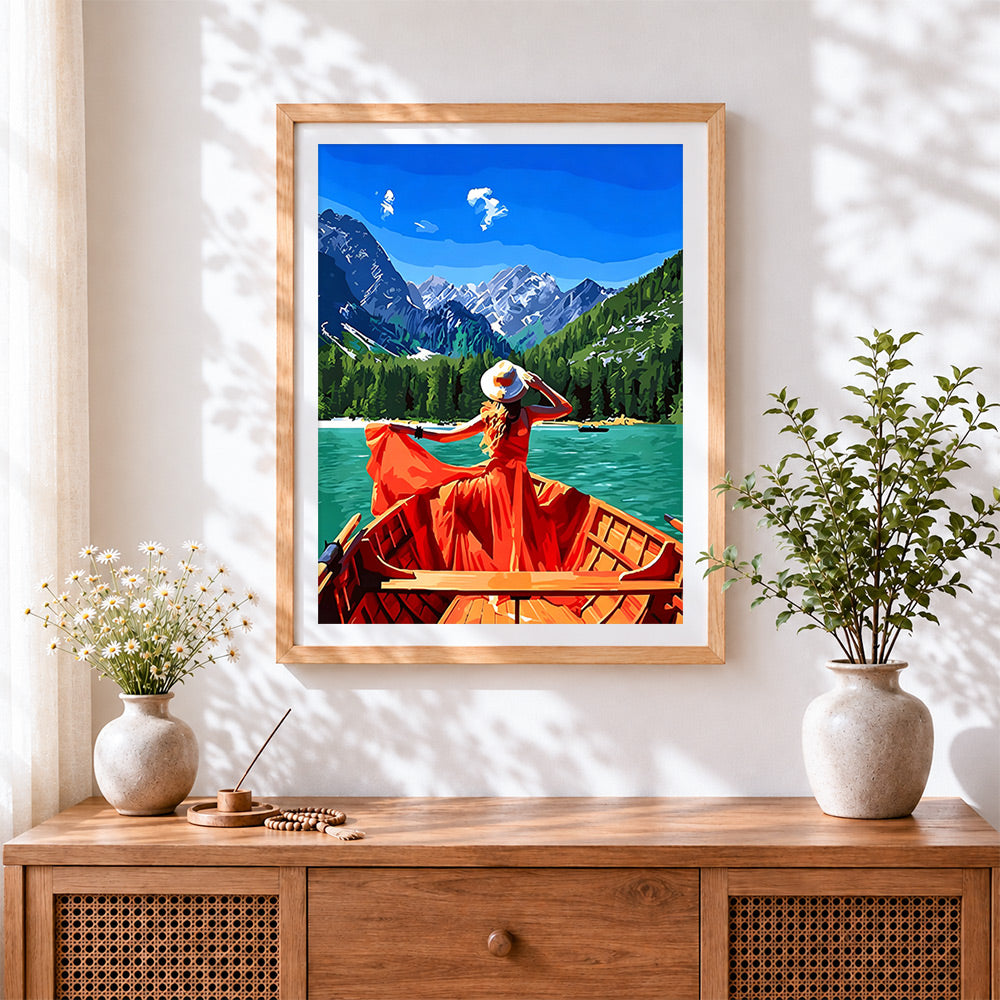 Finished girl in a red dress on a lake cross stitch artwork displayed