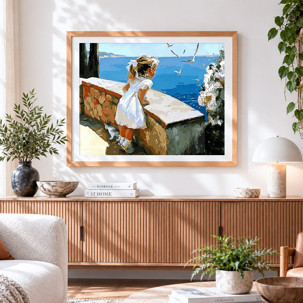 Finished girl watching seagulls by the sea paint by numbers artwork displayed as home decor