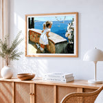 Girl watching seagulls by the sea paint by numbers artwork displayed on wall as home decor