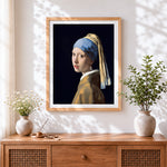 Finished girl with a pearl earring cross stitch artwork displayed