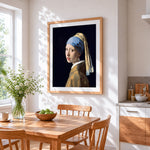 Girl with a pearl earring cross stitch artwork displayed on wall as home decor