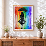 Finished girl with black umbrella in rainbow rain cross stitch artwork displayed